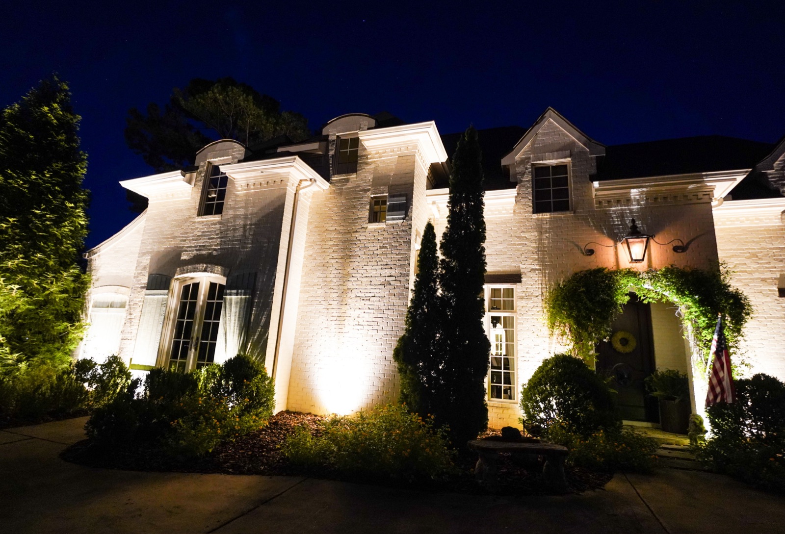 Birmingham home with professional outdoor lighting at night